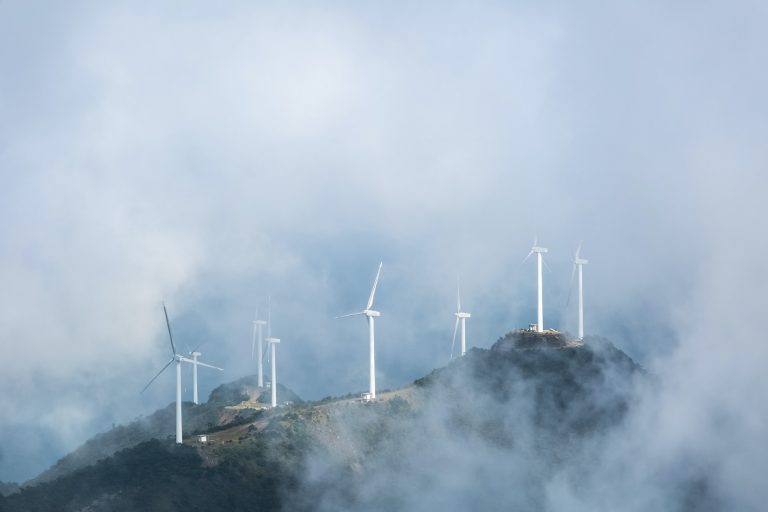 wind farms in the misty clouds